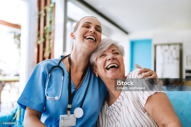 Home care healthcare professional hugging senior patient